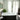 white ceramic bathtub near white wooden framed glass window