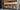 a stack of wood sitting on top of a wooden floor