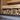 a stack of wood sitting on top of a wooden floor