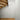 A room with a wooden floor and stairs